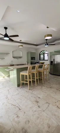a view of a chairs and table in a room