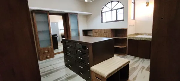 a kitchen with kitchen island a stove and a wooden floor