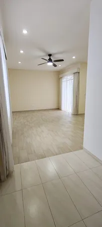 a mini theater with wooden floor