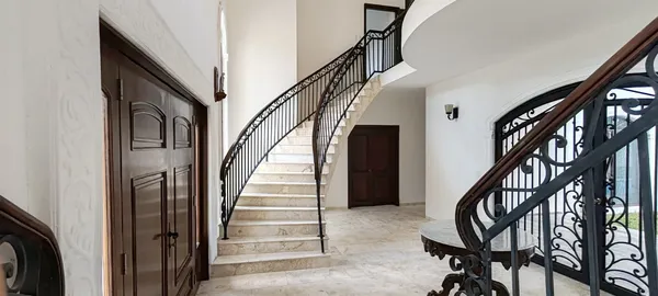 a view of entryway with wooden floor and stairs