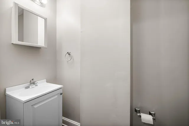 a bathroom with a sink and mirror