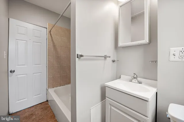 a bathroom with a sink and mirror