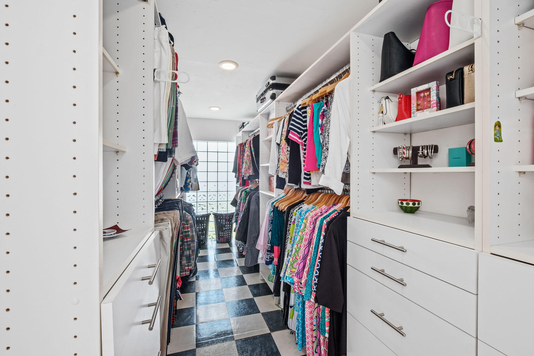 600 Southwest 2nd Street Boca Raton, FL 33486 - Photo 27 of 42 a view of walk in closet with clothes and shoes