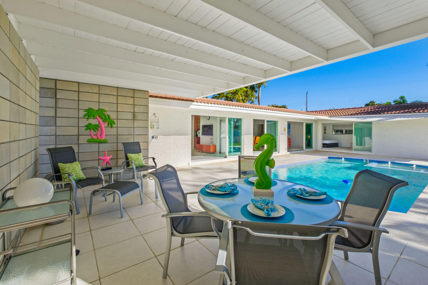 600 Southwest 2nd Street Boca Raton, FL 33486 - Photo 2 of 42 a view of a dining table and chairs in patio
