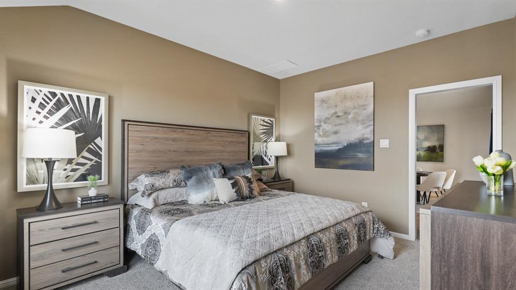 504 Marsh Street Cleburne, TX 76033 - Photo 18 of 39 a bedroom with a bed and wooden floor