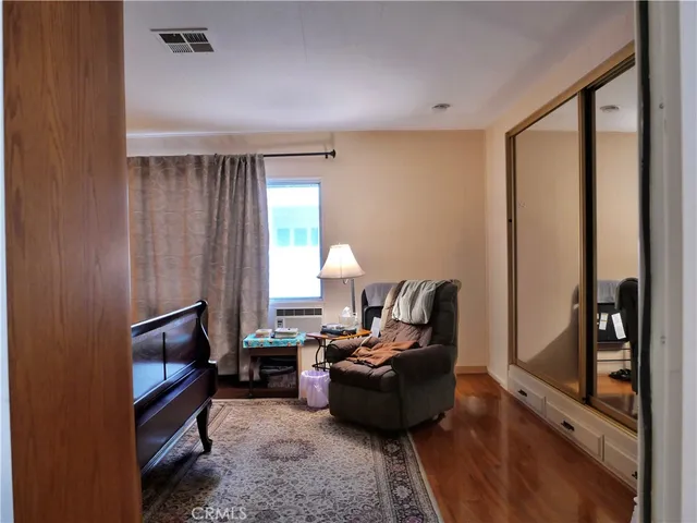 a bedroom with a bed and a table