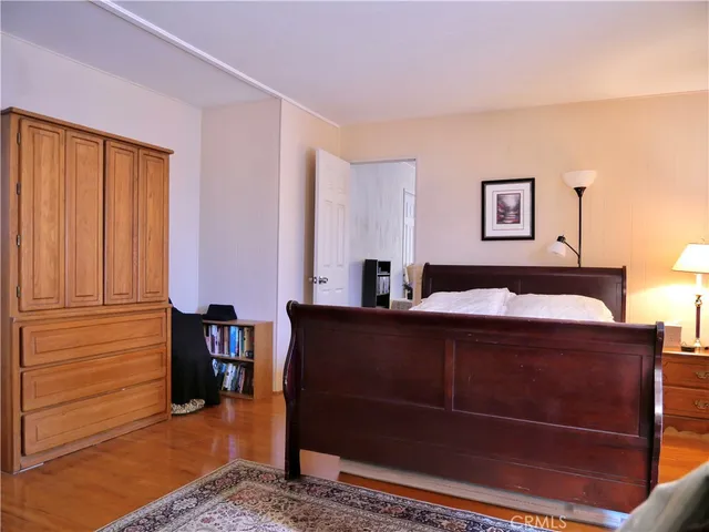 a bedroom with a bed and a closet