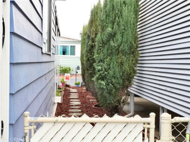 a view of a dining room with furniture and a window