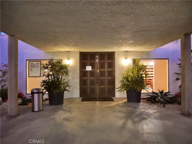 a view of a dining room with furniture and window