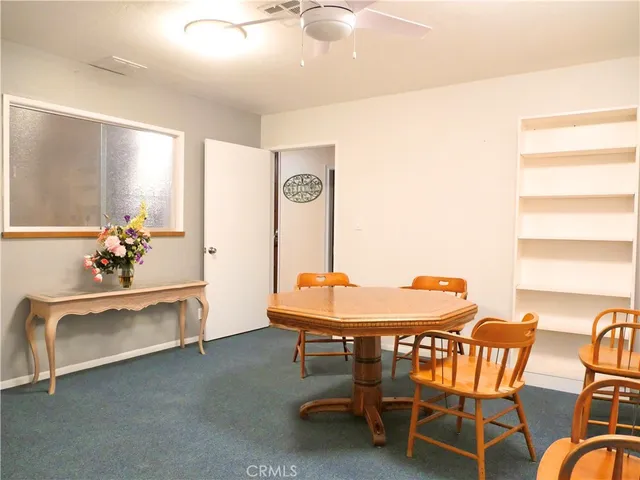 a view of swimming pool with a table and chairs