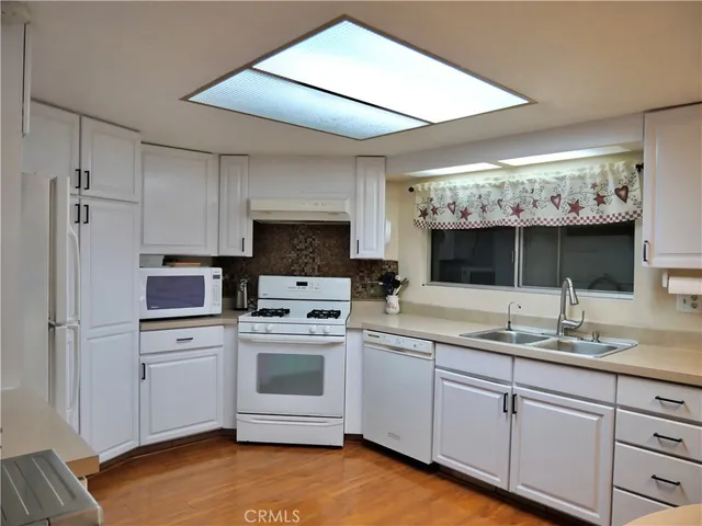 a white toilet sitting next to a shower