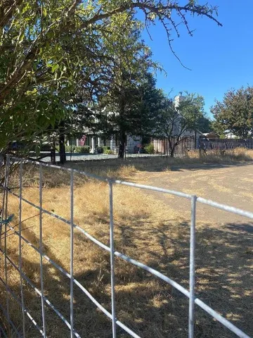 a view of a swimming pool with an outdoor space and seating area