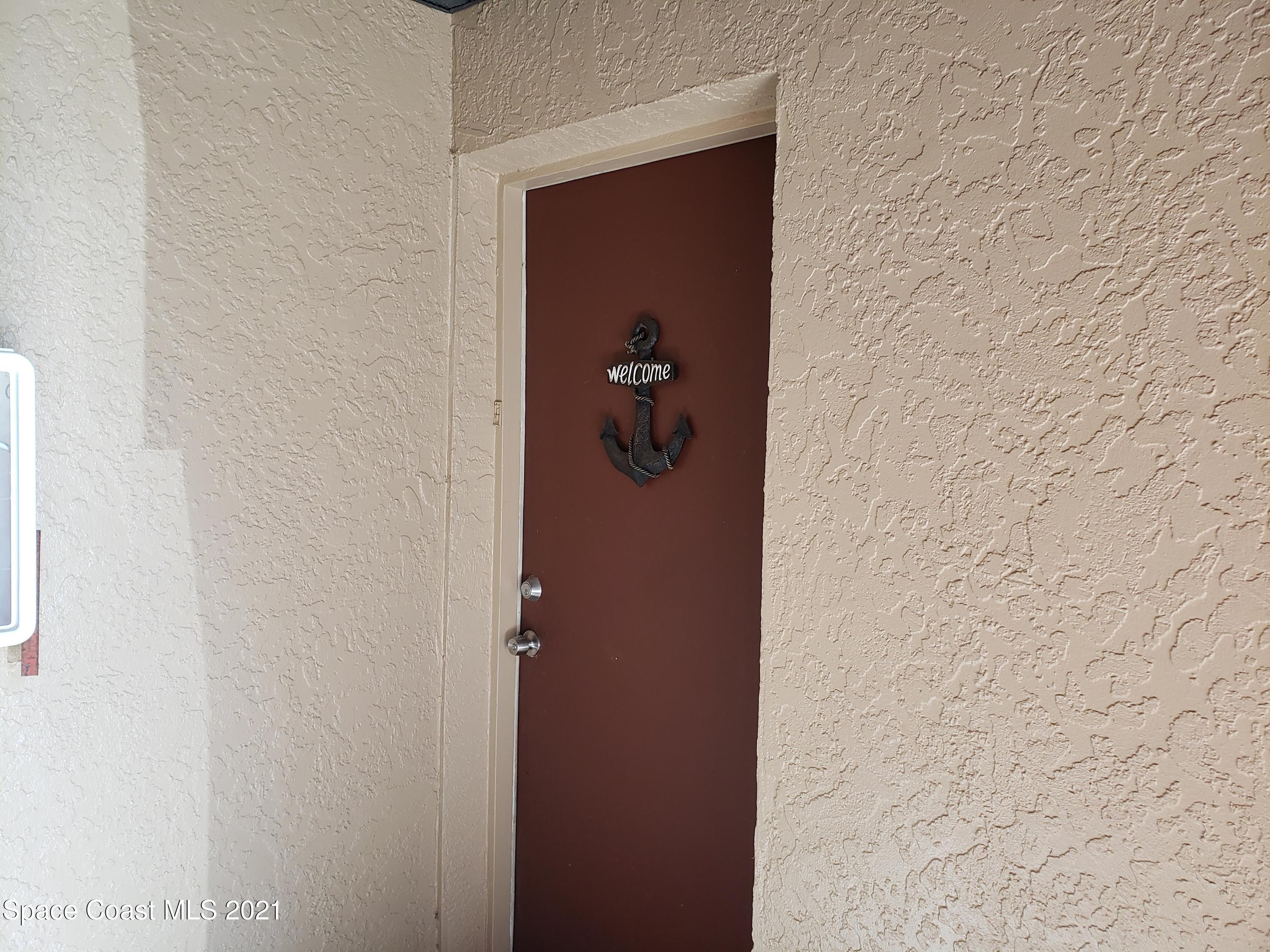 210 Spring Drive, Unit 6 Merritt Island, FL 32953 - Photo 2 of 35 a bathroom with a shower