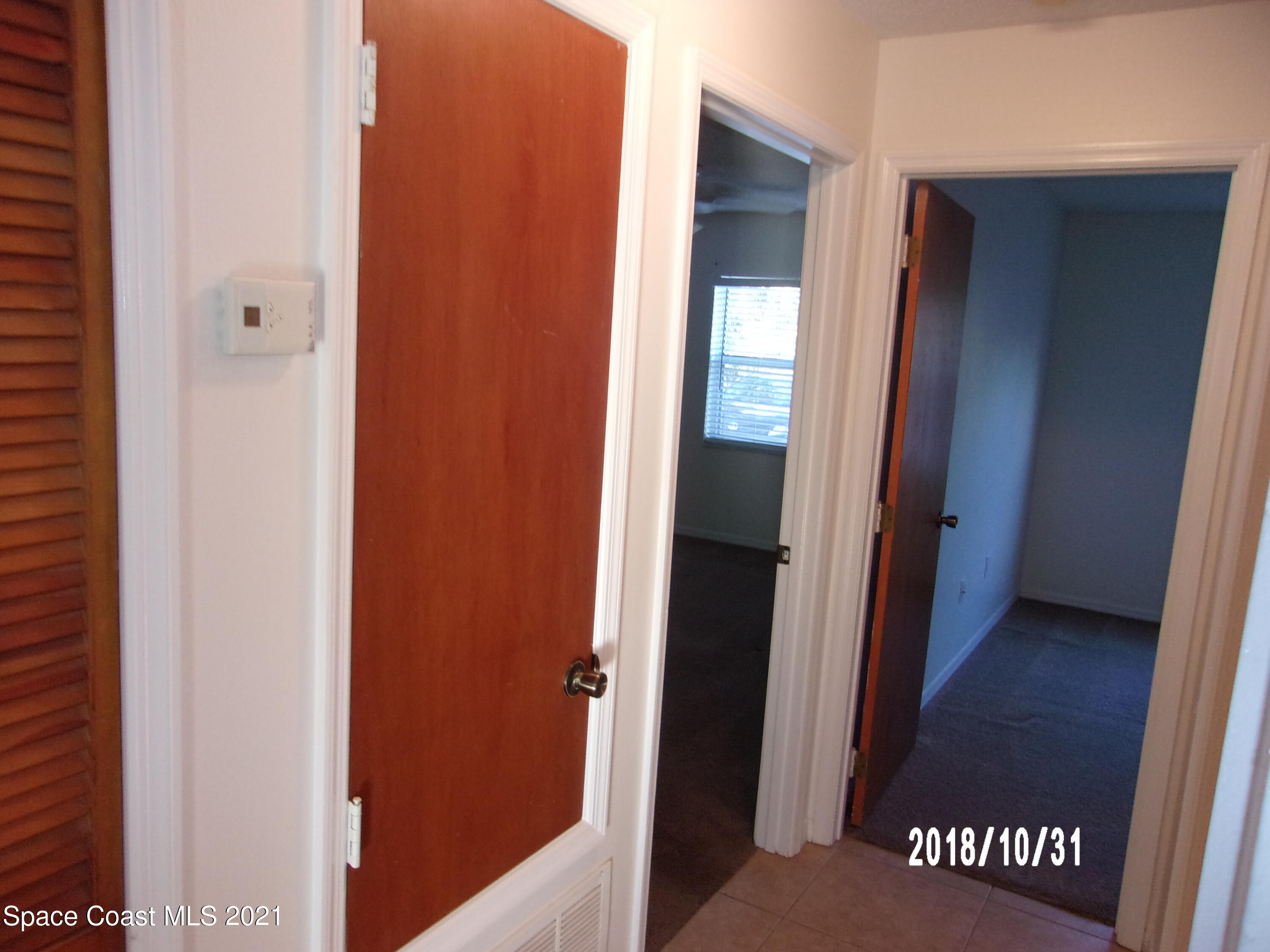 210 Spring Drive, Unit 6 Merritt Island, FL 32953 - Photo 19 of 35 a view of a hallway