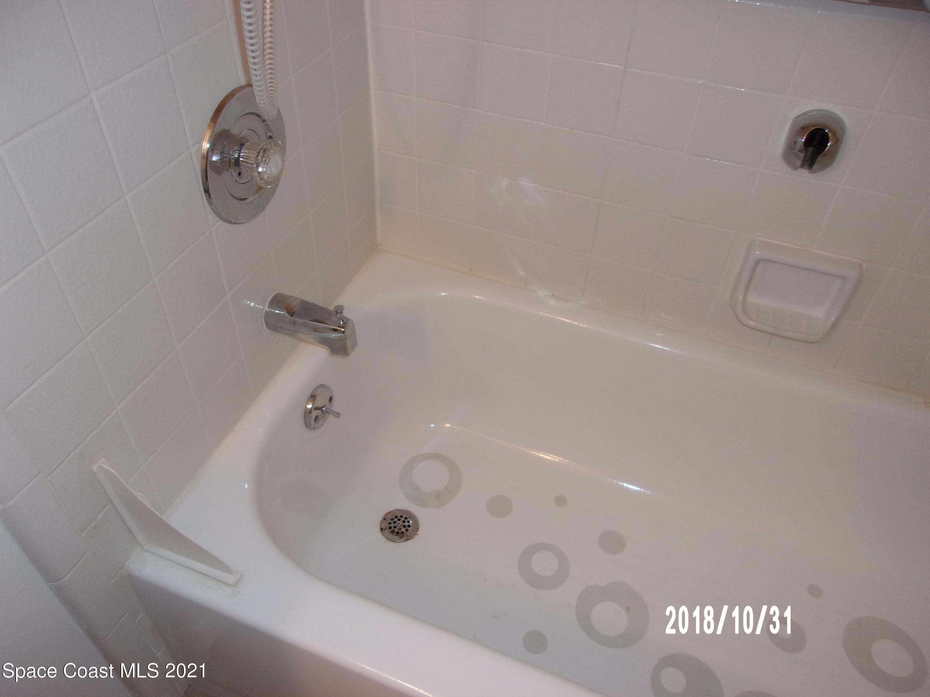 210 Spring Drive, Unit 6 Merritt Island, FL 32953 - Photo 22 of 35 a bathroom with a shower