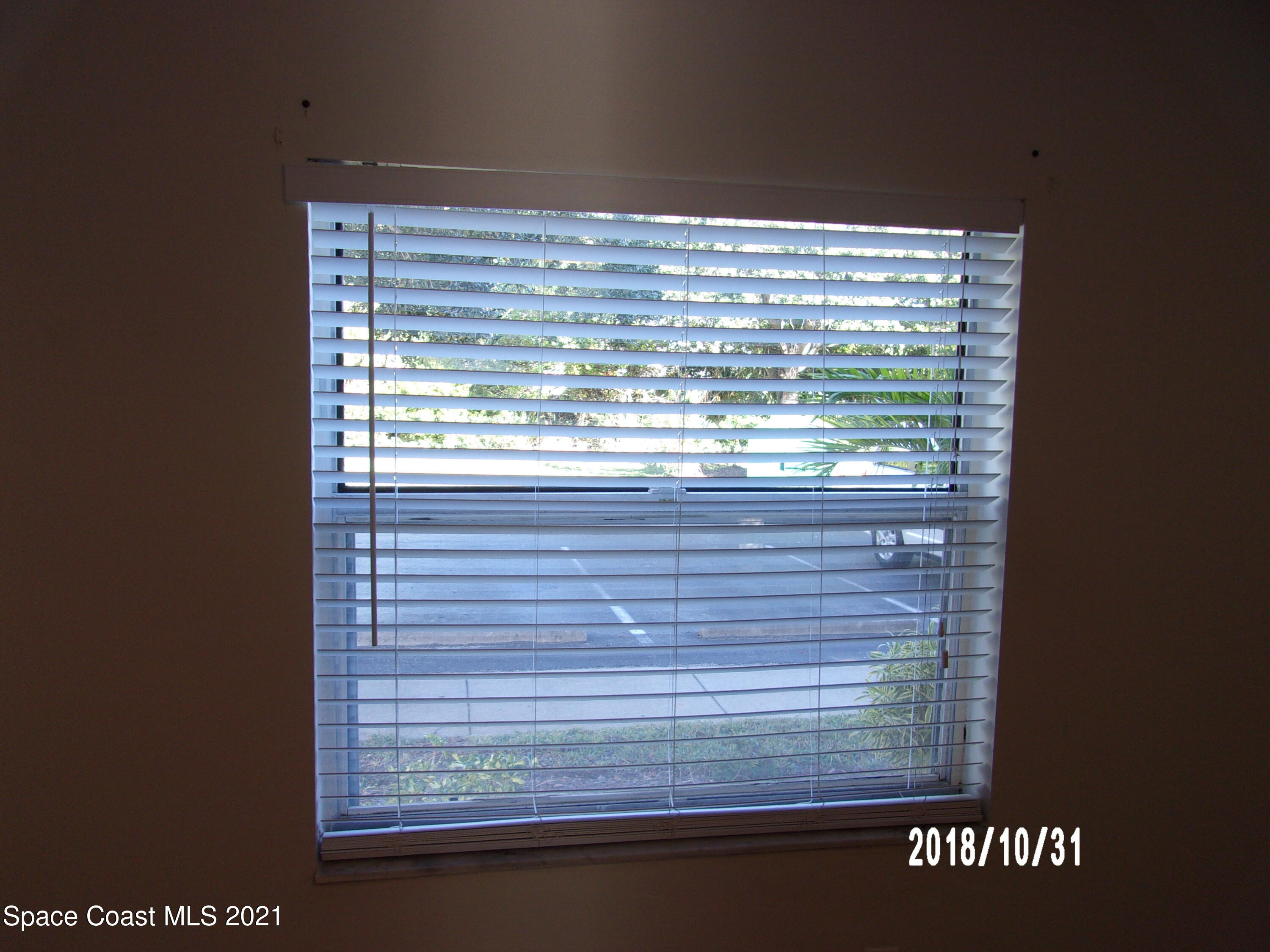 210 Spring Drive, Unit 6 Merritt Island, FL 32953 - Photo 25 of 35 a view of a window