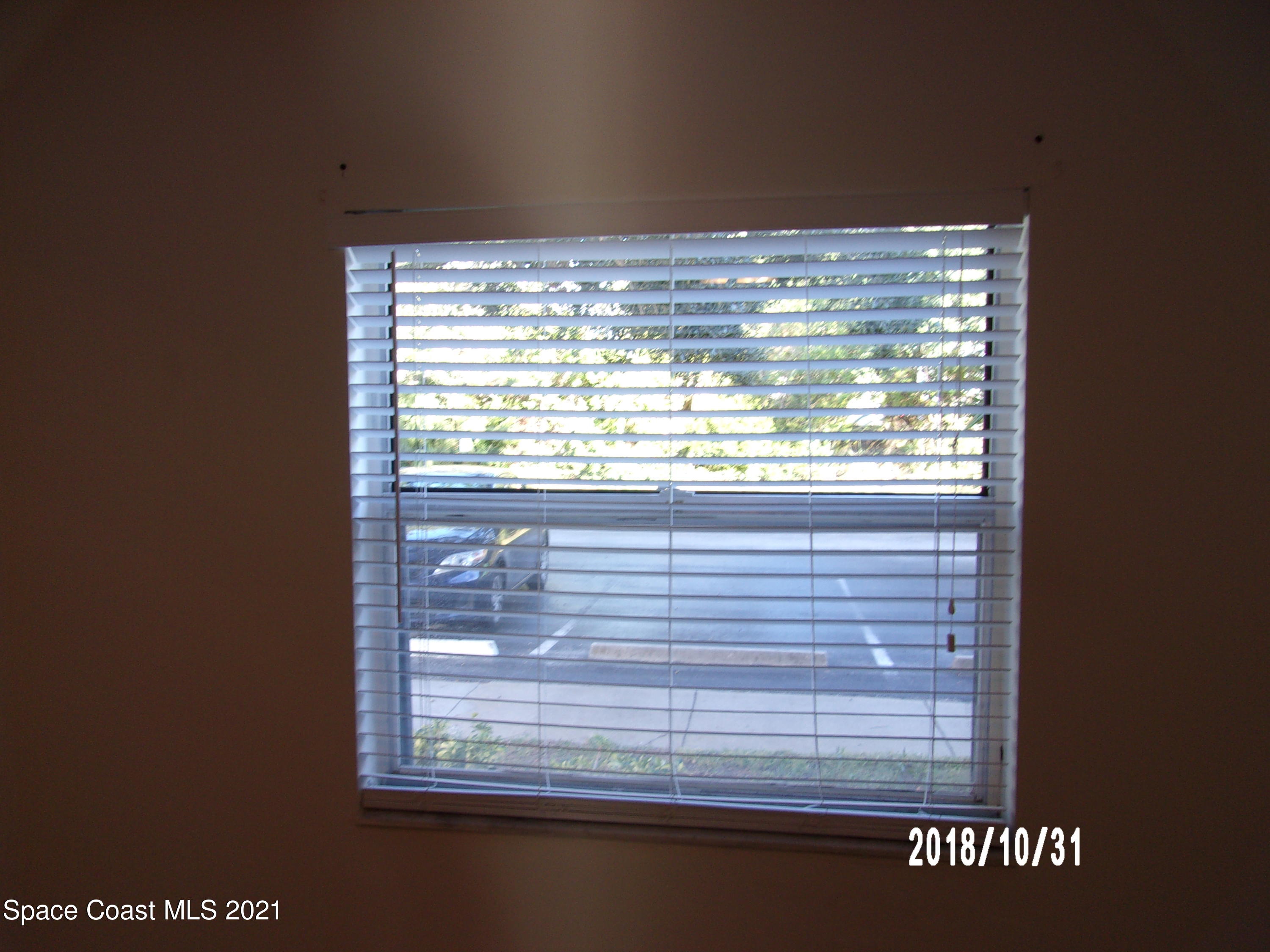 210 Spring Drive, Unit 6 Merritt Island, FL 32953 - Photo 29 of 35 a view of a window