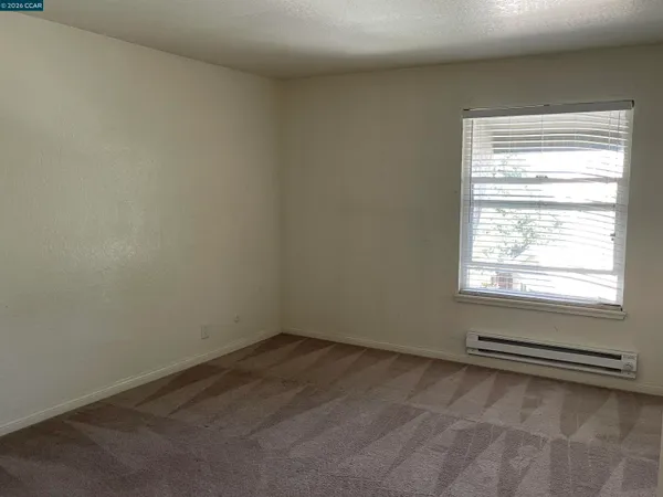 a view of a room that has a window in it