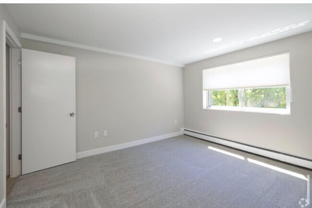 1 Stonehill Drive, Unit 4B Stoneham, MA 02180 - Photo 12 of 20 an empty room with a window