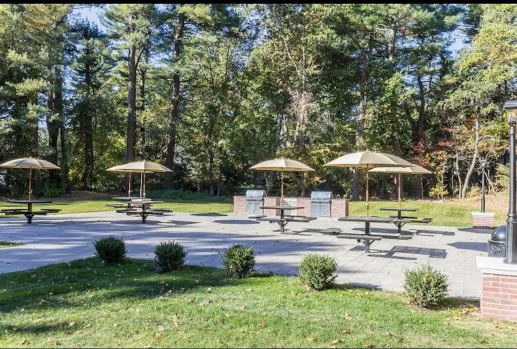 1 Stonehill Drive, Unit 4B Stoneham, MA 02180 - Photo 14 of 20 a swimming pool with outdoor seating and yard