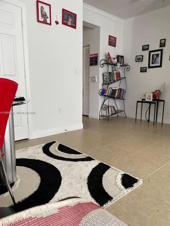 a bedroom with a bed and a chair