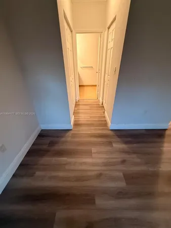 a view of entryway with wooden floor