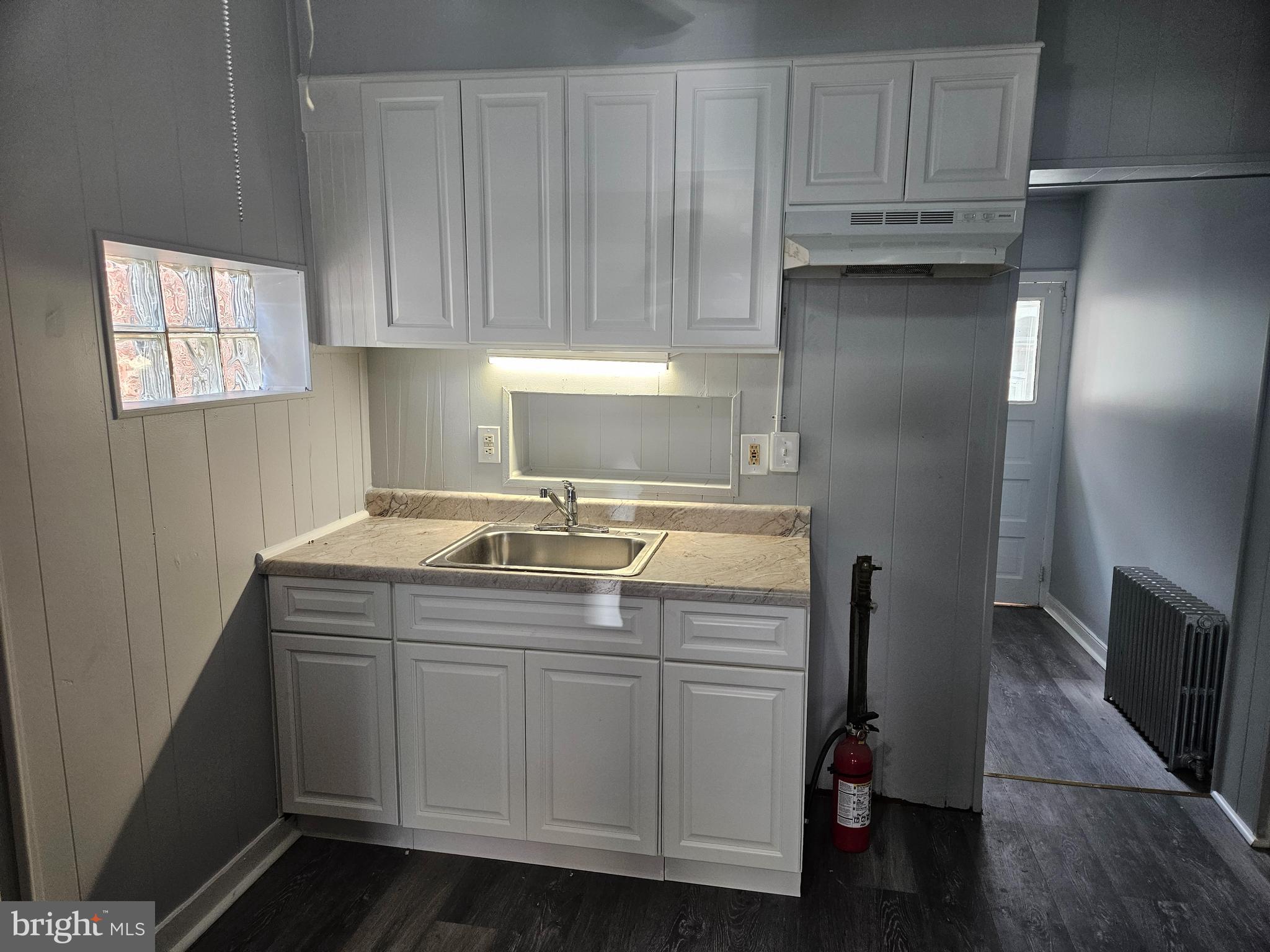 812 Kohn Street Norristown, PA 19401 - Photo 3 of 9 a kitchen with stainless steel appliances granite countertop a sink and a refrigerator