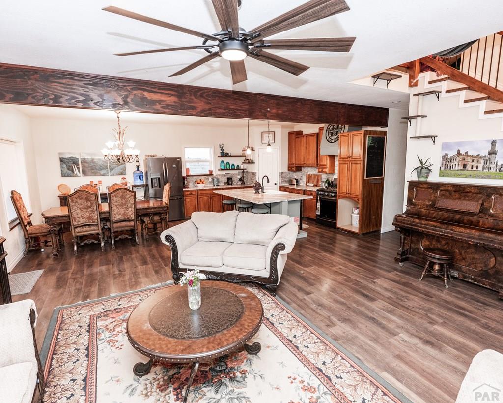 1611 Big Vista Road Rye, CO 81069 - Photo 4 of 27 a living room with furniture and a floor to ceiling window