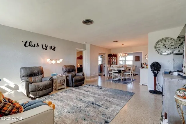 a living room with furniture and a table