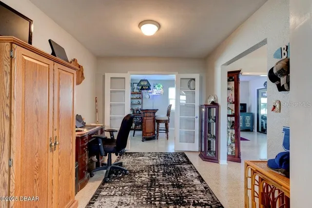 a bedroom with a bed and a television