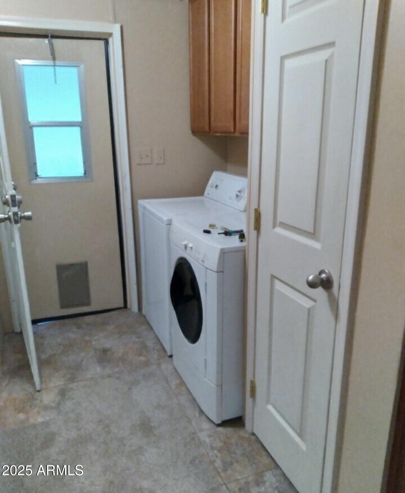 757 North Dapple Road Apache Junction, AZ 85119 - Photo 8 of 9 a utility room with a window dryer and washer