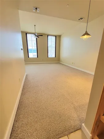 a view of empty room with windows