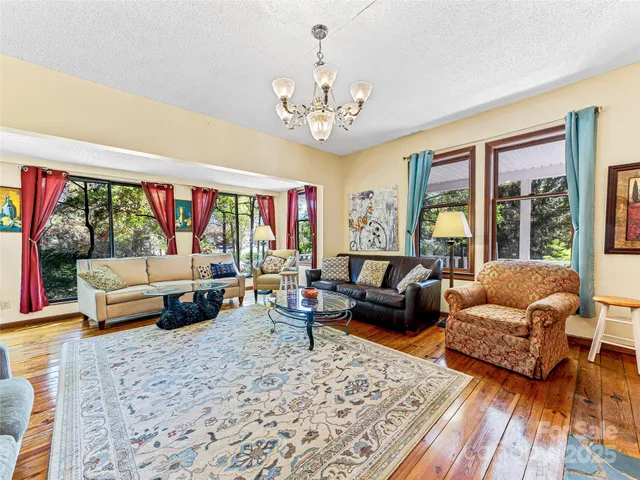 a view of a living room with furniture and a window