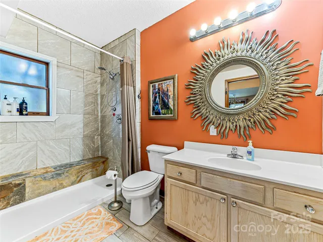 a bedroom with two beds and a chandelier