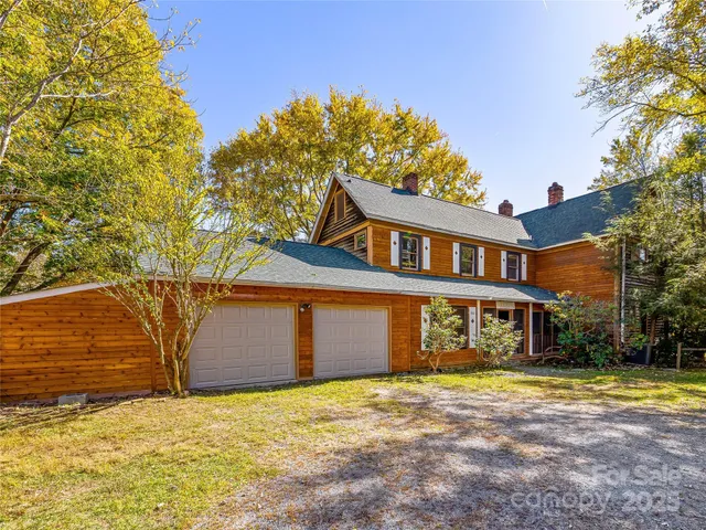 a view of a patio with table and chairs and potted plants
