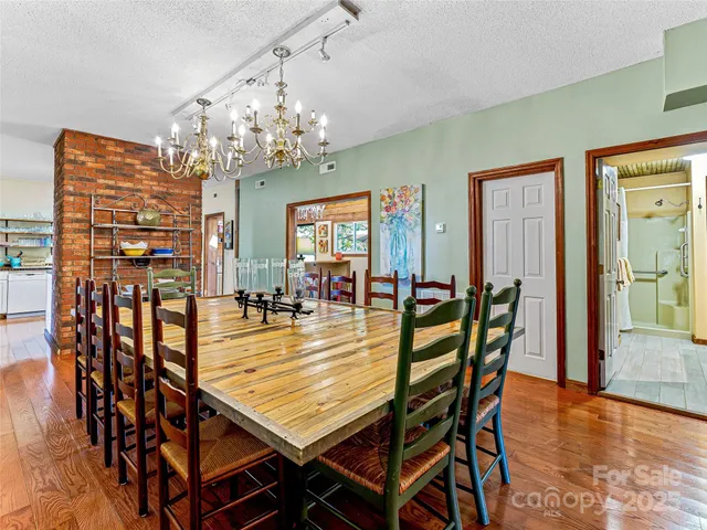 a living room with lots of wooden furniture