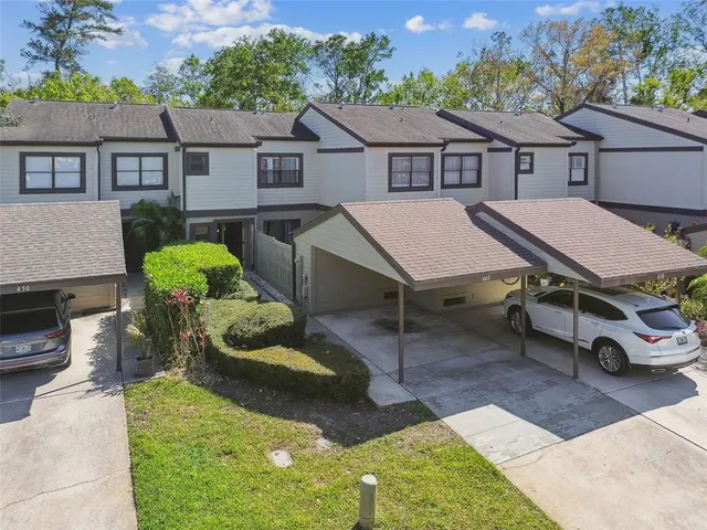 a aerial view of a house with table and chairs in a patio