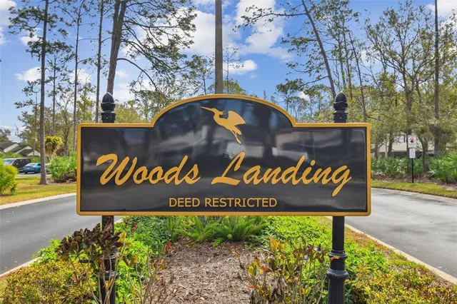 a street sign that is sitting on a sidewalk