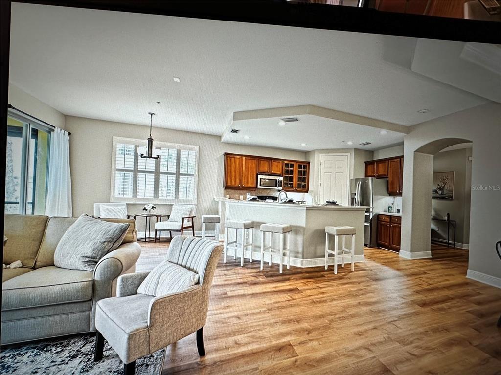 1121 Riverscape Street Bradenton, FL 34208 - Photo 12 of 74 a living room with furniture and a wooden floor