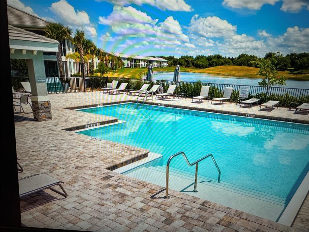 1121 Riverscape Street Bradenton, FL 34208 - Photo 16 of 74 a view of a swimming pool with outdoor seating