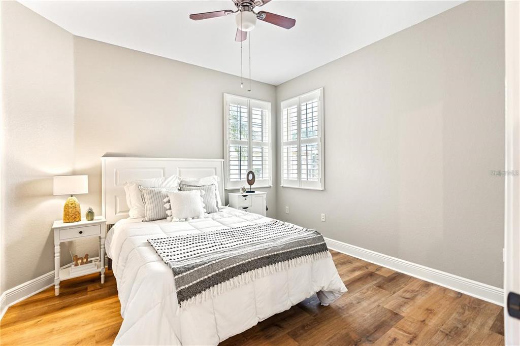 1121 Riverscape Street Bradenton, FL 34208 - Photo 26 of 74 a bedroom with a bed and a chandelier