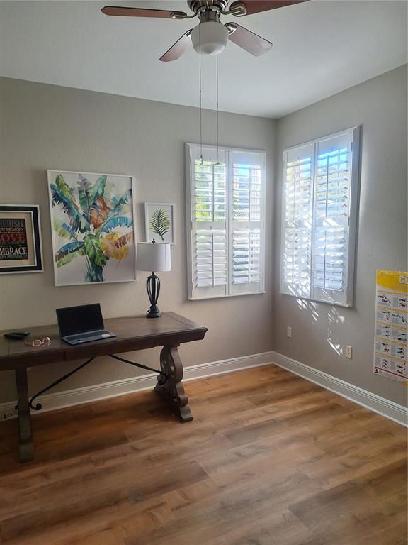 1121 Riverscape Street Bradenton, FL 34208 - Photo 29 of 74 a living room with furniture a window and a chandelier