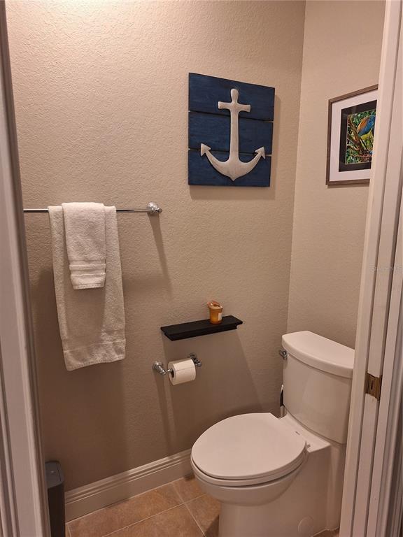 1121 Riverscape Street Bradenton, FL 34208 - Photo 34 of 74 a white toilet sitting next to a small bathroom