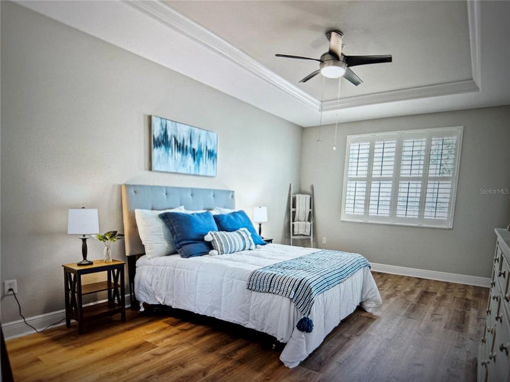 1121 Riverscape Street Bradenton, FL 34208 - Photo 6 of 74 a bedroom with a bed and a window