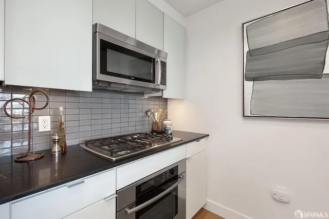a kitchen with a stove and a microwave