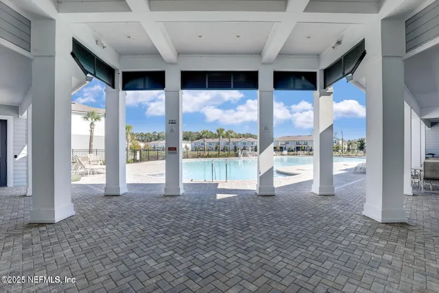 a view of a swimming pool with a patio