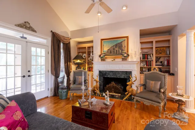 a living room with furniture and a fireplace