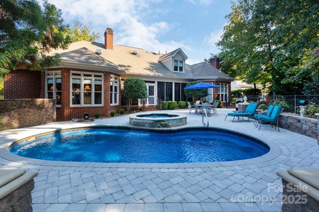 a view of a patio with swimming pool table and chairs