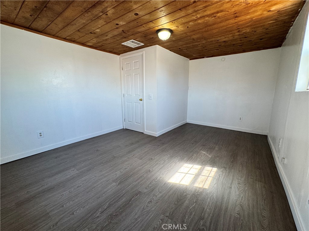 36528 Irwin Road Barstow, CA 92311 - Photo 11 of 35 a view of empty room with wooden floor