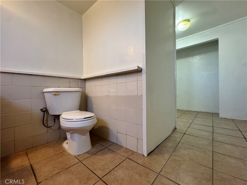 36528 Irwin Road Barstow, CA 92311 - Photo 15 of 35 a white toilet sitting next to a bathroom sink